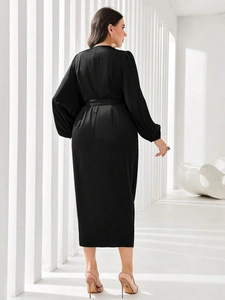Elegant black satin midi dress with V-back design and waist belt for women