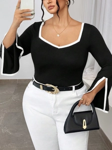 Slim fit black square neck knit top with white contrast trim and flared slit sleeves