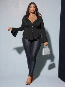 Plus size v-neck long sleeve blouse with ruffled trim and black leather leggings