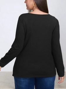 Back view of a black long-sleeve plus-size top with a round neck and soft knit fabric