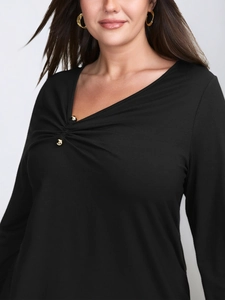 Women's black V-neck long sleeve shirt with pleated chest detail and gold buttons