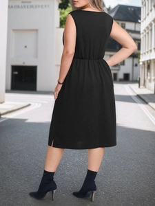 Elegant sleeveless black midi dress with elastic waist and side slit on urban street background