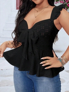 Women's black sleeveless eyelet top with large bow detail and ruffled hem design