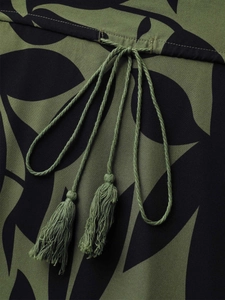 Detailed macro view of olive green floral dress with waist drawstring and tassels