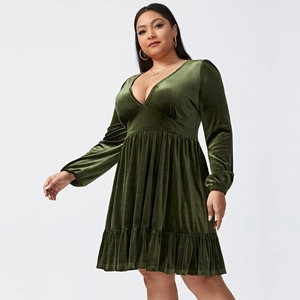 Detail view showing deep V-neck and luxurious olive green velvet texture of plus-size dress