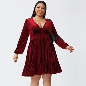 Detailed view of the deep V-neck and velvet fabric texture on the burgundy party dress