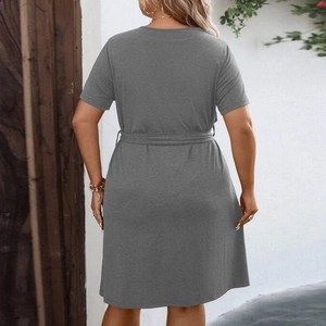 Elegant dark grey V-neck A-line dress with short sleeves and waist tie, back view outdoors