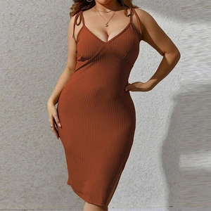 Detail of the V-neck and ribbed texture on this sexy caramel spaghetti strap dress