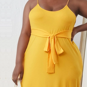 Elegant bright yellow knitted midi dress with waist belt for summer vacation and leisure wear