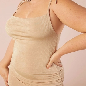 Champagne gold slim fit party dress with side ruching and delicate textured fabric