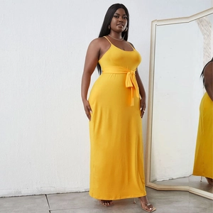 Detailed view of ginger yellow plus size maxi dress with waist bow tie and thin straps