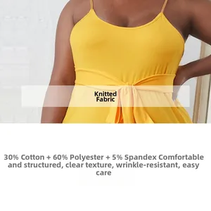 Detail of ribbed knit fabric texture and waist belt on a yellow sleeveless summer maxi dress