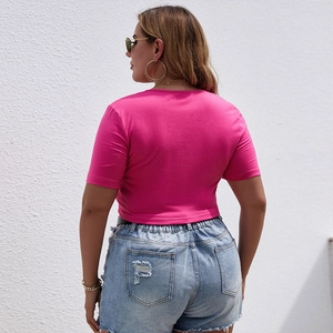 Slim fit rose pink square neck crop top paired with distressed blue denim shorts