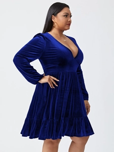 Detailed view of royal blue velvet mini dress featuring V-neck and ruched waist texture