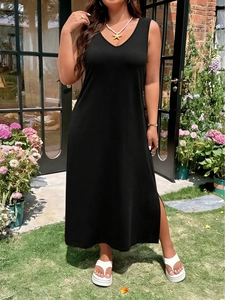 Close-up of black V-neck maxi dress featuring side slit and soft knit fabric details