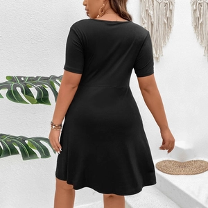 Detail view of black ribbed knit A-line dress back design with textured fabric surface