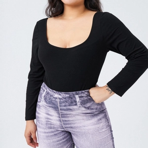 Close-up of black U-neck long sleeve bodysuit with vintage purple print trousers