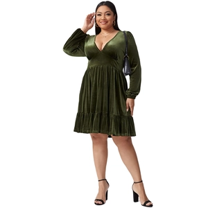 Plus size dark green velvet mini dress with deep V-neck and ruffled hemline