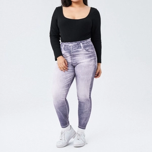 Close-up of high-waist slimming leggings with grey-purple gradient denim print and knit texture