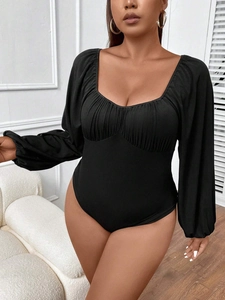 Slim fit black ribbed knit bodysuit with puff sleeves and square neckline for women