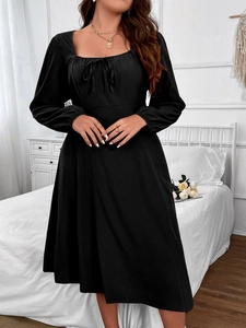 Elegant black square neck A-line dress with long puff sleeves and lace-up front detail