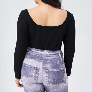 Detailed back view of a black ribbed knit bodysuit featuring a deep U-shaped open back design