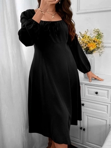 Detail of square neckline with lace-up bow on black long-sleeve A-line midi dress