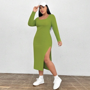 Close-up of grass green ribbed knit dress featuring a side slit and slim fit texture
