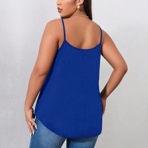 Rear view of a navy blue plus size camisole showing thin straps and a curved hem design