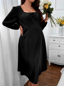 Detail of square neckline with bow tie on black long sleeve A-line dress for women