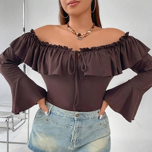 Detail of ruffle neckline with tie-up strings on a brown off-shoulder bell sleeve top