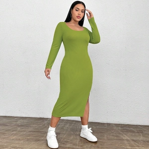 Detail view of grass green ribbed knit midi dress with side slit and slim fit design