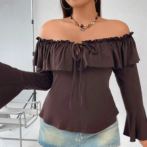 Detail of ruffle neckline and tie knot on long flare sleeve off shoulder top