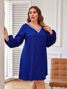 Plus size royal blue V-neck dress with beige lace trim and long lantern sleeves