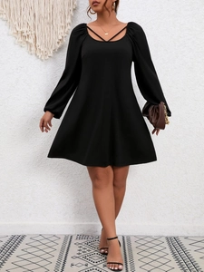 Elegant black A-line dress with long puff sleeves and a crossover neckline design