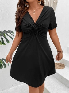 Plus size black V-neck ribbed A-line dress with a twist knot waist for a slim fit