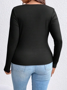 Eng anliegendes schwarzes Langarm-T-Shirt für Damen aus Rippstrick mit rundem Ausschnitt