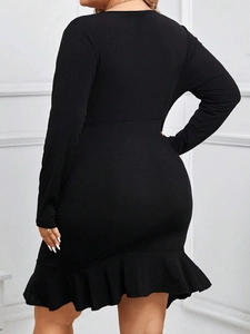 Plus size black long sleeve ruffled mermaid dress with elegant vertical ribbed texture