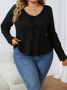 Women's plus size V-neck ribbed knit top in black with adjustable drawstring tie details