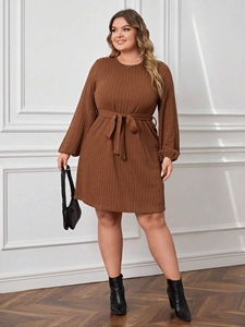 Brown ribbed knit plus size A-line dress with long puff sleeves and waist tie belt
