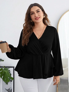 Close-up of black chiffon long sleeve wrap blouse with V-neck and peplum waist detail
