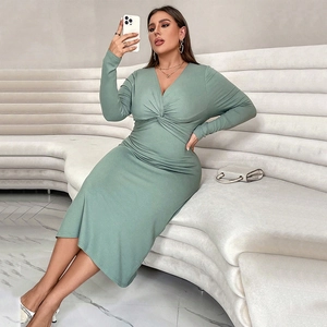 Sage green V-neck midi knit dress with long sleeves and elegant twist knot waist detail