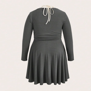 Slim fit dark grey ribbed knit long sleeve dress with halter back and A-line silhouette