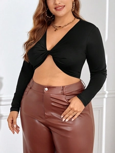 Women's chic black long sleeve crop top with twist front design and cutout detail