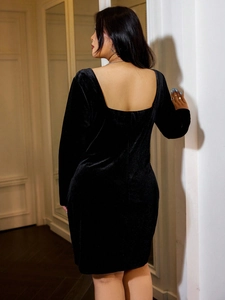 Slim fit black velvet dress with elegant square back and bodycon silhouette