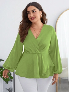 Detailed view of lime green chiffon blouse featuring deep V-neck and peplum waist design