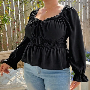 Women's black square neck puff sleeve top with smocked waist and ruffle trim