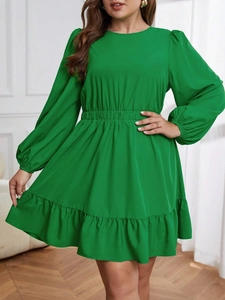 Elegant emerald green plus size mini dress with ruffled hem and long puff sleeves