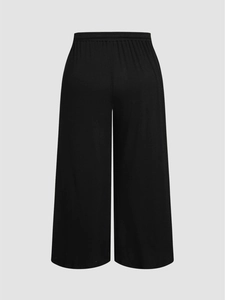 Pantalon large grande taille noir pour femme avec taille haute élastique en maille