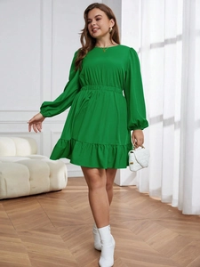 Elegant green plus size dress with puff sleeves and ruffled hem in a bright grass tone